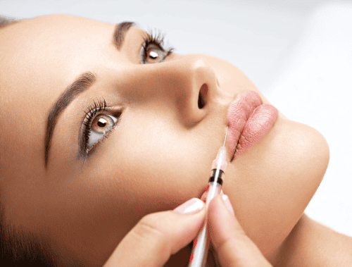 Young woman getting Lip Fillers Treatment | The Natural Aesthetic Medspa in Sykesville, MD