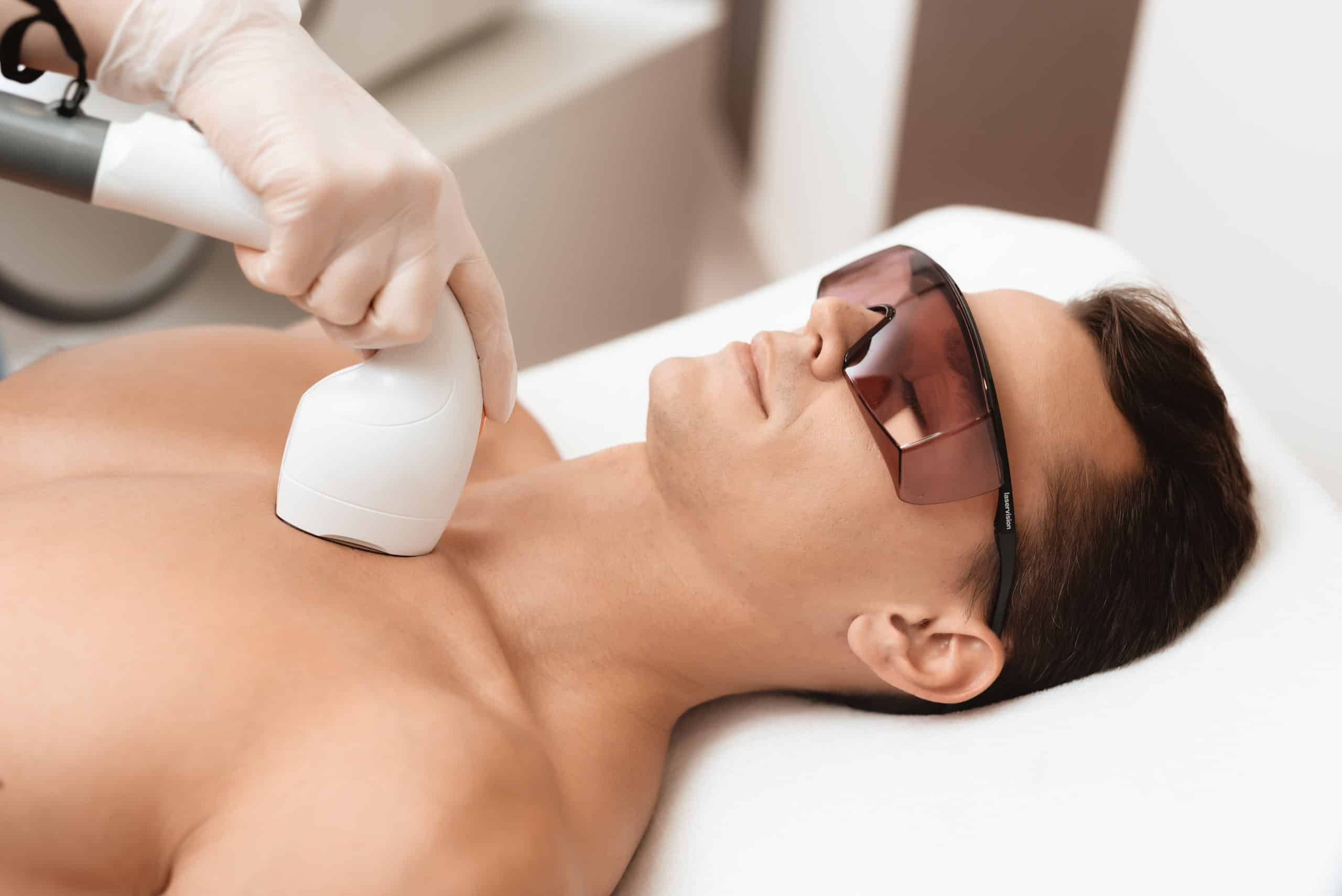 Calm young man Getting Laser Hair Removal on chest | The Natural Aesthetic Medspa in Sykesville, MD