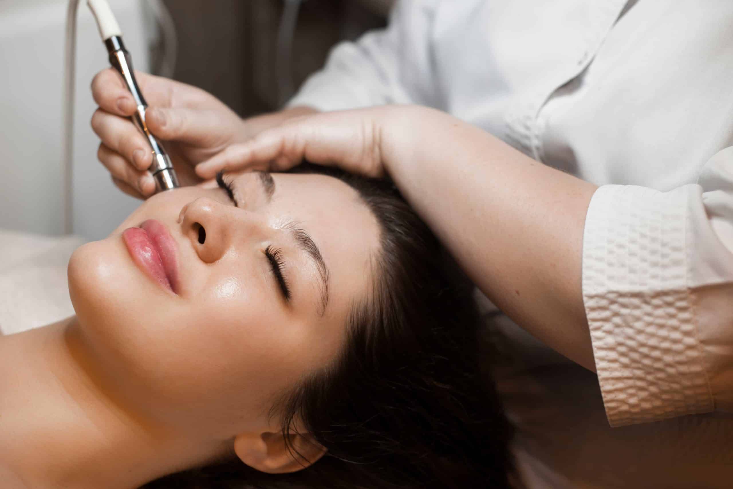 Young woman getting Microneedling Treatment | The Natural Aesthetic Medspa in Sykesville, MD