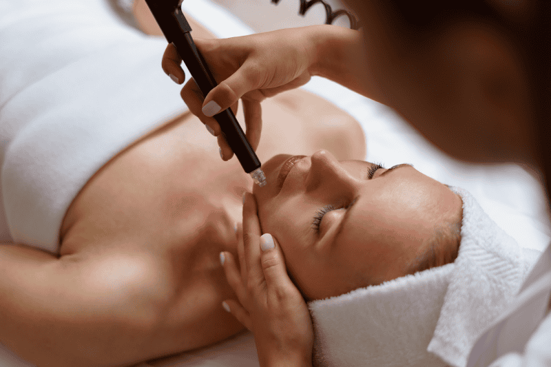 Young Woman getting Hydrafacial Treatment | The Natural Aesthetic Medspa in Sykesville MD
